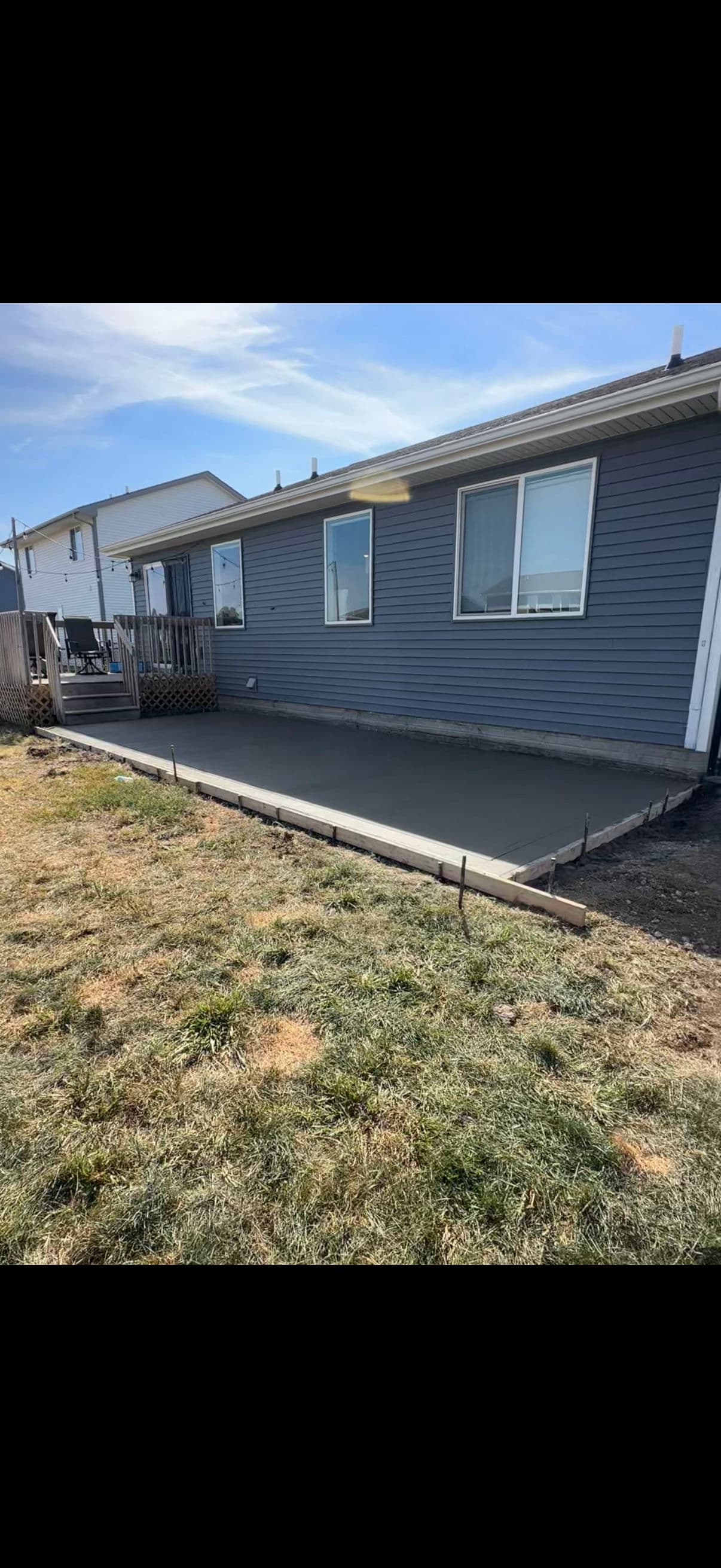 Beautiful Backyard Concrete Patio Installation image